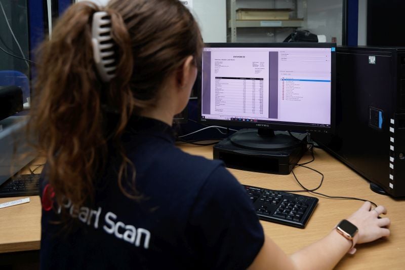 a person capturing data data onto a computer system