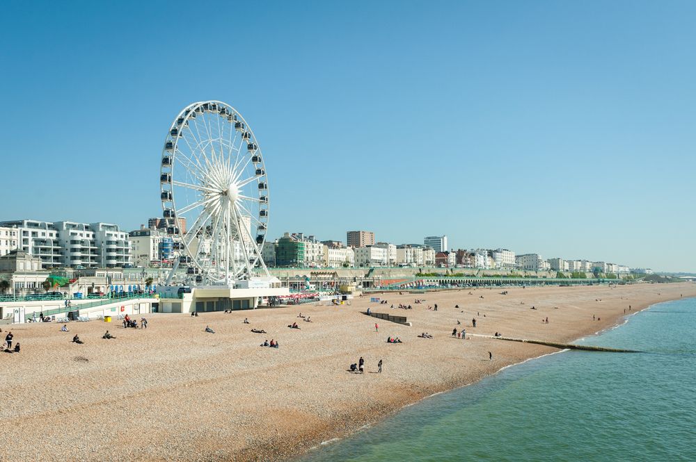 Clear blue sky over Brighton beach, UK and the tourist attractions of Madeira Drive