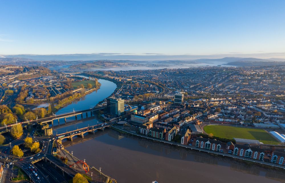 Newport, Wales, UK – November 18, 2019: An aerial view at sunrise of Newport city centre, south wales United Kingdom, taken from the River Usk