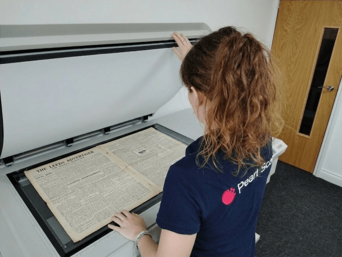 “Large format newspaper scanning service capturing vintage newspapers in high resolution for archives”